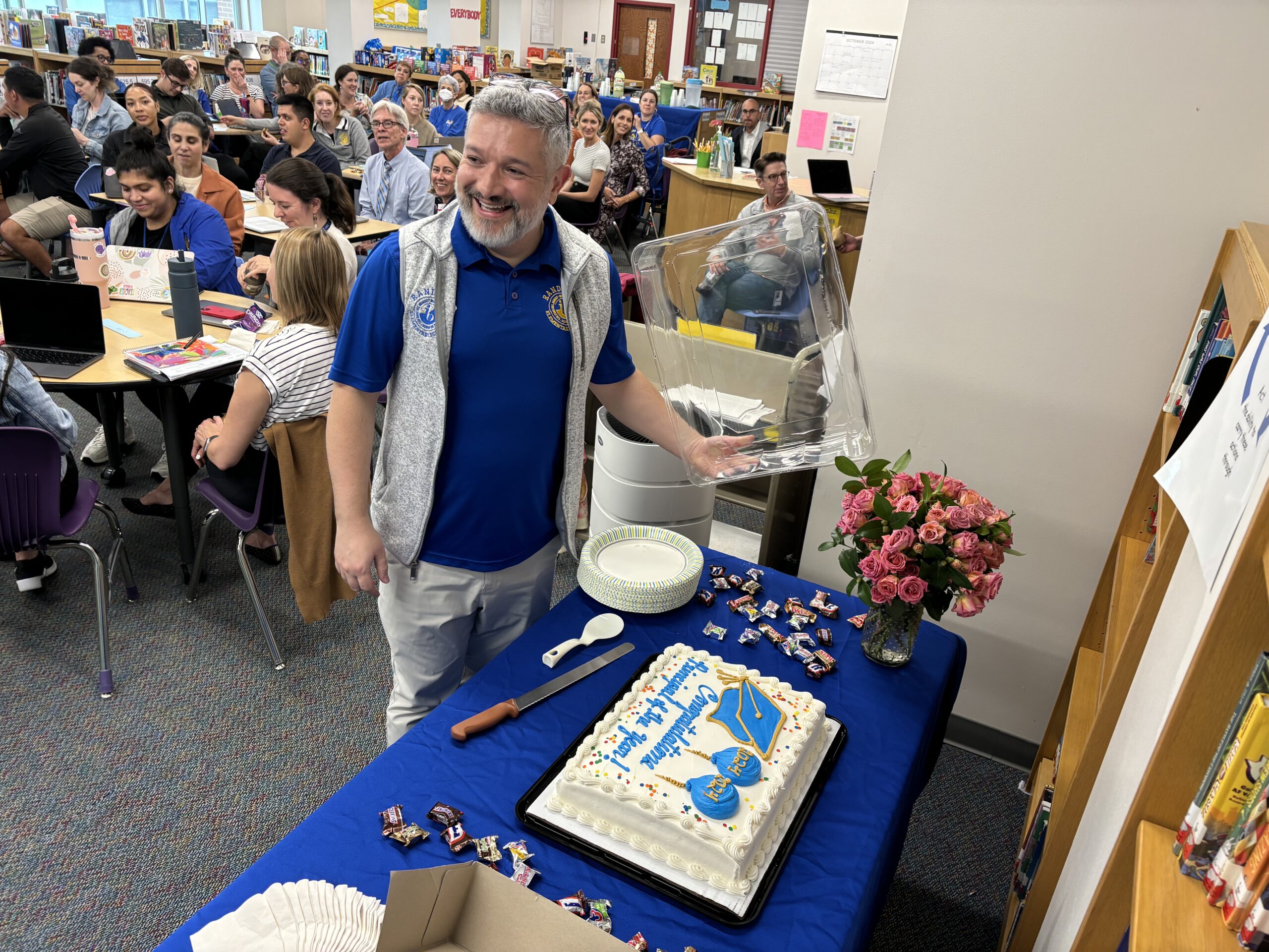 Carlos being celebrated with a cake